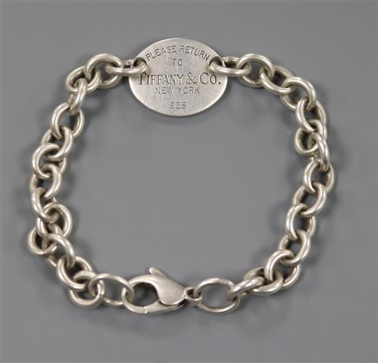A Tiffany & Co 925 sterling oval link bracelet with engraved plaque Please Return to Tiffany & Co, New York.